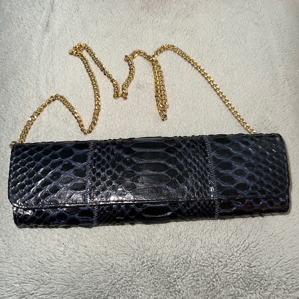 Carlos Falchi python clutch with gold chain.